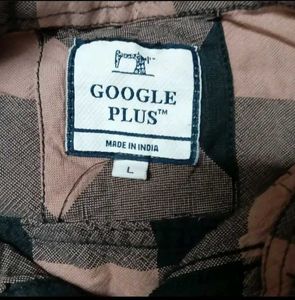 A Check Shirt With Black Or Peach Colour Combinati