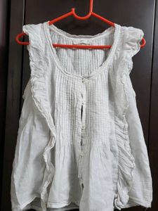 Ruffled Sleeveless White Top