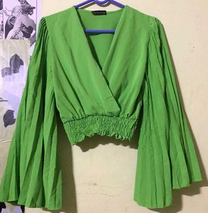 Bright green crop top.