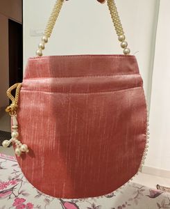 Regal Pink Pearl Potli Bag with Embellished Handle