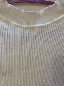 combo of white ribbed shirt and cotton shorts