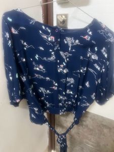 Blue Top With White Graphics