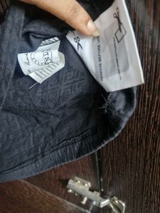 Black Smocked Off-Shoulder Top
