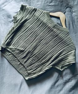 top or sweater in a muted sage green