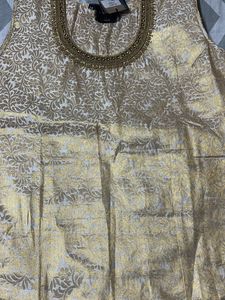 A Traditional Gold Top With Beautiful Neck To