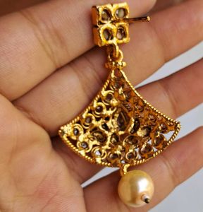 Gold-toned choker with earrings and headpiece