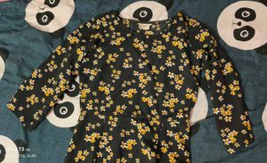 Black dress with yellow n white flowers