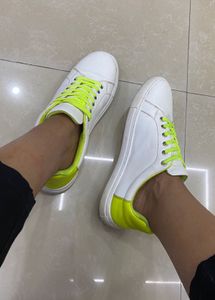 White Sneakers with Neon Green Accents