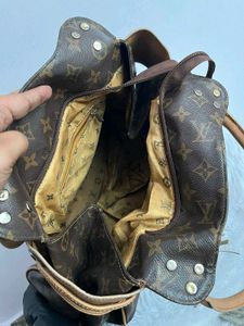 Louis Vuitton Logo Handbag with tassel