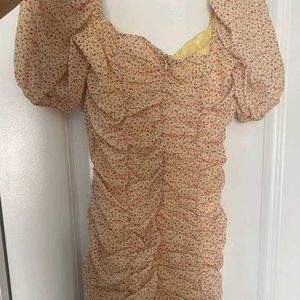 nude floral ruched mini dress with puff sleeves