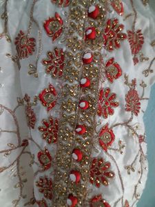 Beautiful White Coloured Gown. Festive Type.