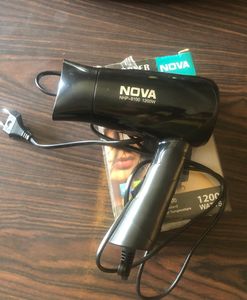 Nova hair dryer , with one year warranty , new pack piece and never used