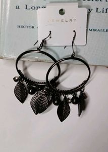A Pair Of Black Hoop earrings