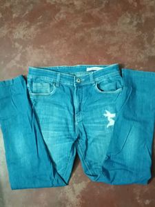 Distressed Denim Jeans With Scratches