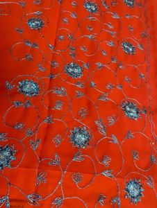 Orange Saree With Blue Shiny Embroidery