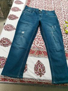 Ripped Blue Denim Jeans