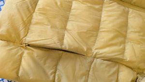 Uniqlo ultra light down jacket in butter yellow