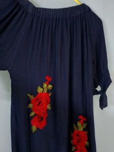 A Beautiful Western Dress With Red Roses