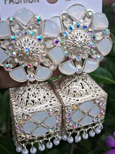 white jhumka earrings