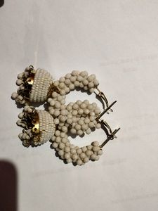 A Plastic Work Jhumka With Whitish Colour
