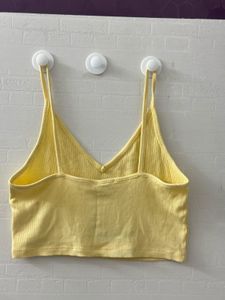 Cute yellow ribbed crop tank top.