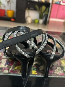 Love in black shimmer strap heels