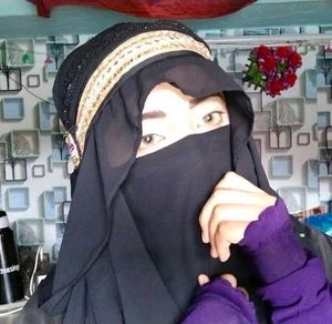 Sana Khan  Elegant Black Hijab with Gold Tr