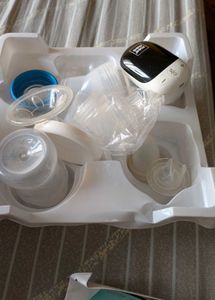 Electric Breast Pump With Feeding Bottle.