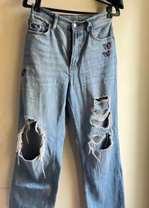 Ripped Denim Jeans with Butterfly Embroidery