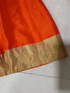 Ethnic Orange Skirt/ Lehenga With Golden Border
