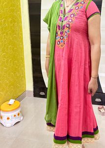 Party Wear Carrot Colour Cotton Anarkali With Embroidery &amp; Lace And Green Dupatta