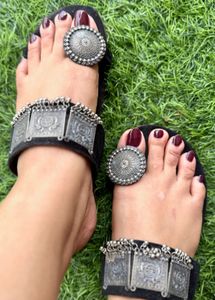 Elegant Black Ethnic Sandals with Ornate Silver Em