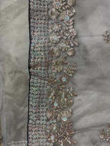 Greyish Blue Net Saree With Sequin Work And Tassel