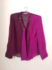 Branded two- tone wrap top.