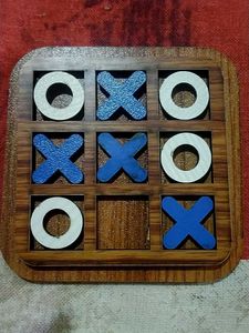 a wooden tic tak toe game board with 8 pieces