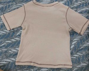 beige crop top with brown heart