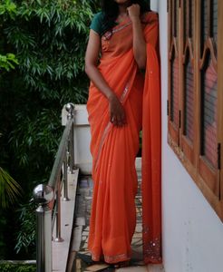 Orange Saree With White Stone Work