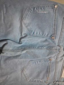 Distressed Light Wash Denim Jeans