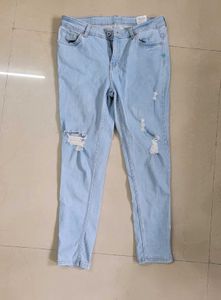 Ripped Light Wash Denim Jeans