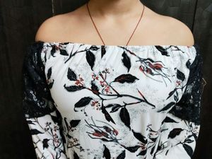 An Elegant White Off Shoulder Top