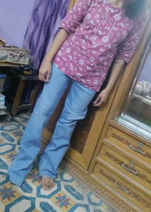 full length flared blue jeans