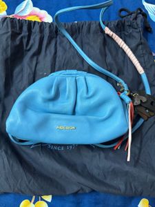 Hidesign sling with leather charm n dust bag