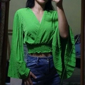 Bright green crop top.
