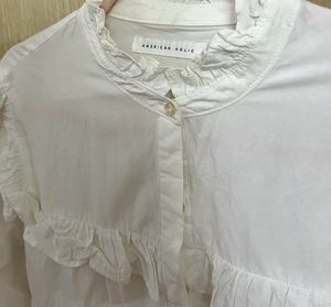 Elegant White Ruffle Blouse with High Neck Detail