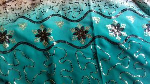 Chiffon Or Suythetic Saree.