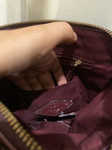 Fossil burgundy sling bag