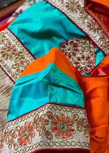 Orange Saree With Turquoise And GoldenBorder