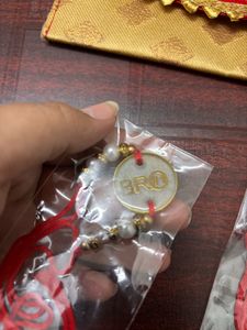Pack Of 2 Resin Rakhi With A Money Holder