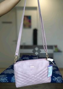 Pink Mochi Sling Bag With Quilted Front And Solid