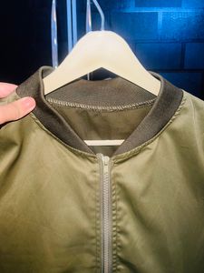 Olive Green jacket.